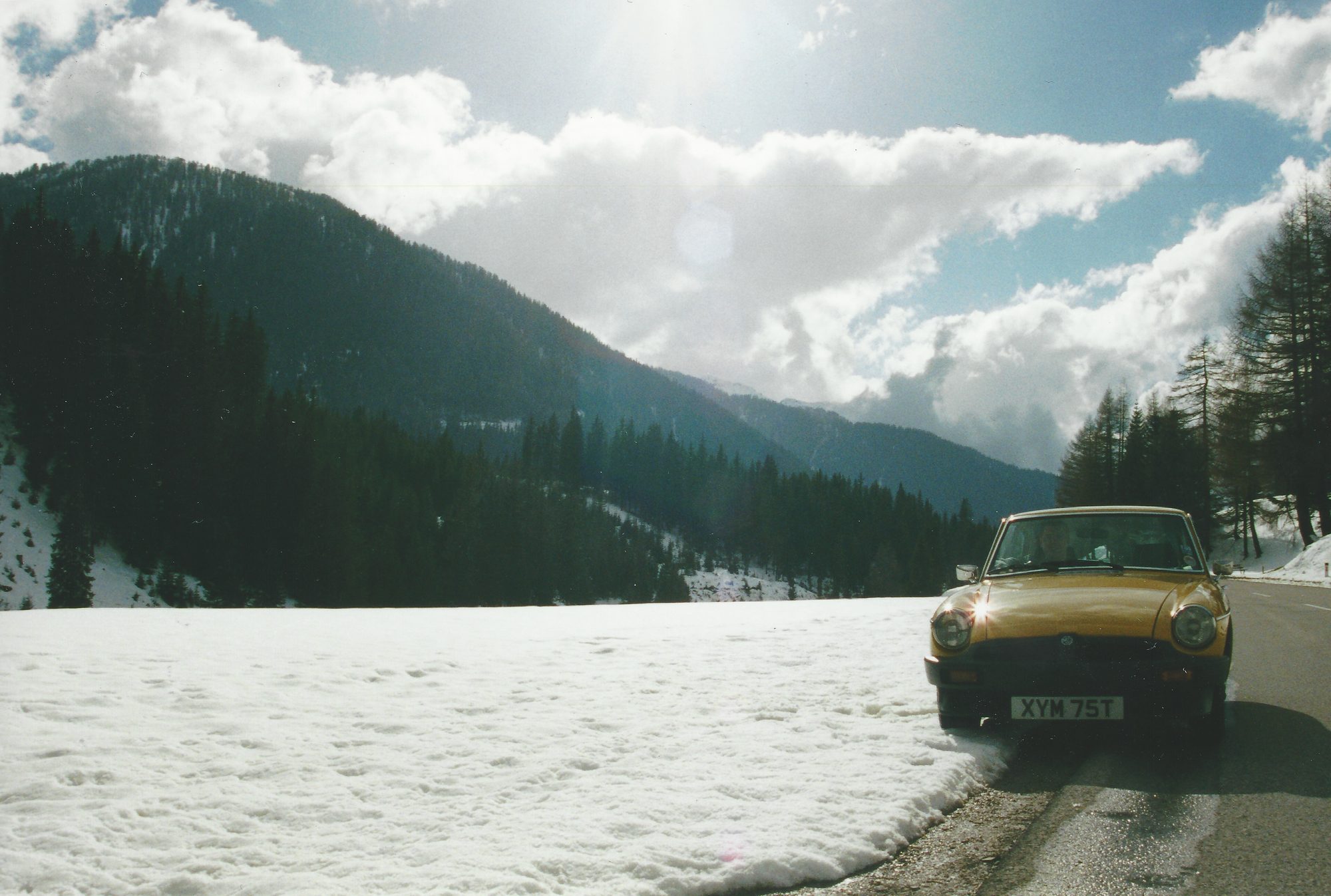 Parked by the snow and quietly hoping a car older than us would start again