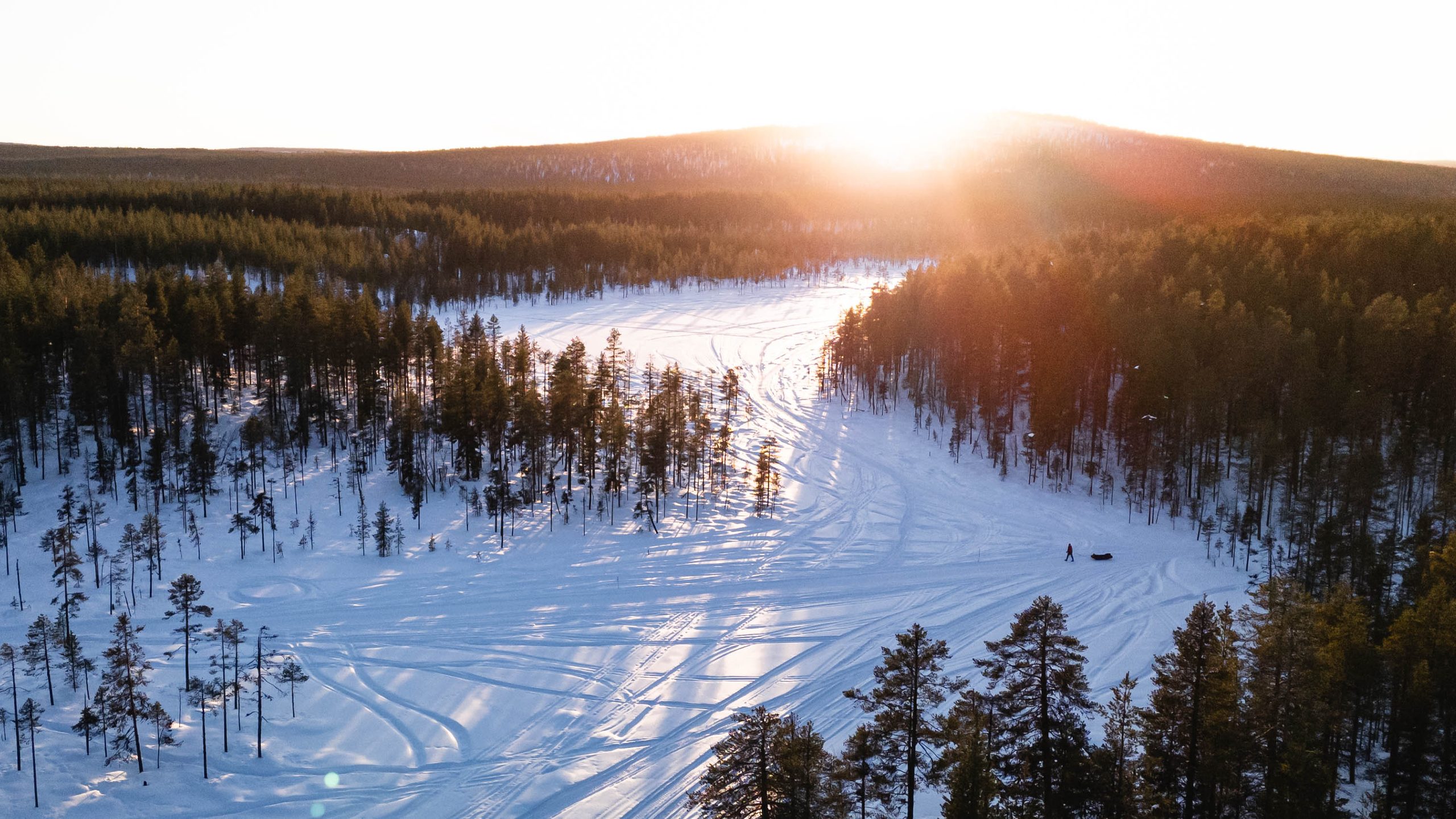 Lapland Arctic Ultra 2026: me and the sled from the air at sunset, a long way from anywhere