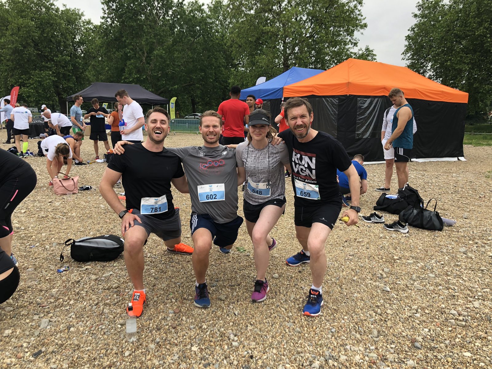 The team, crouched by the gazebos. Me far left, in the orange shoes